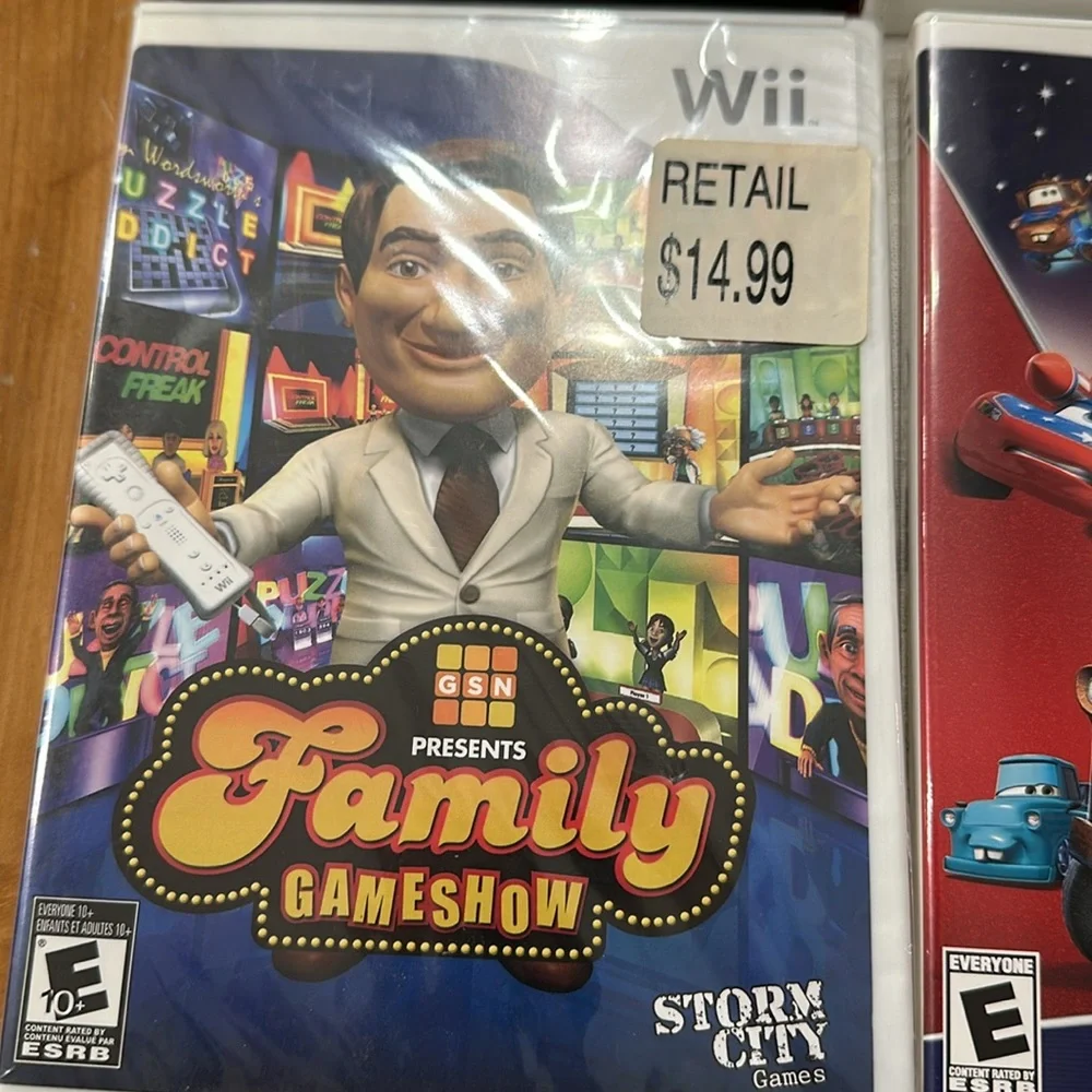 Nintendo Wii black w 2 remotes and 7 games.6 games in cases 1 has no case.